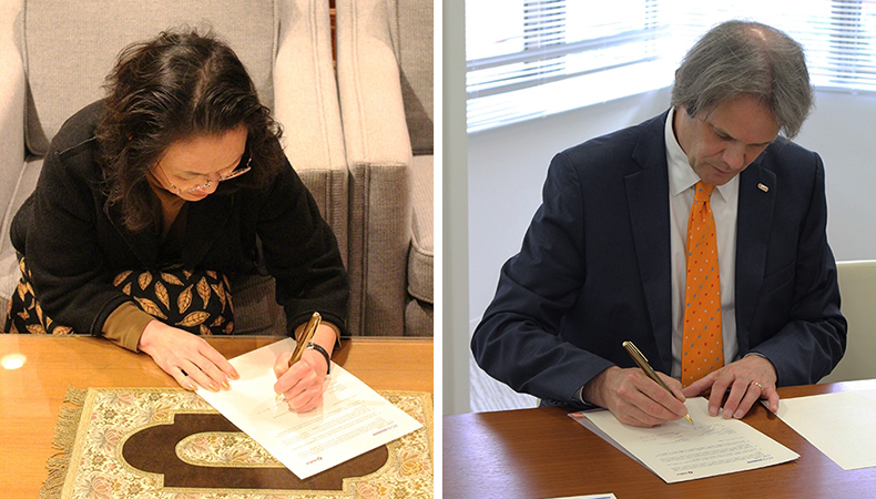 ICU President Junko Hibiya (on left) and NOHA President Joost Herman signing the agreement